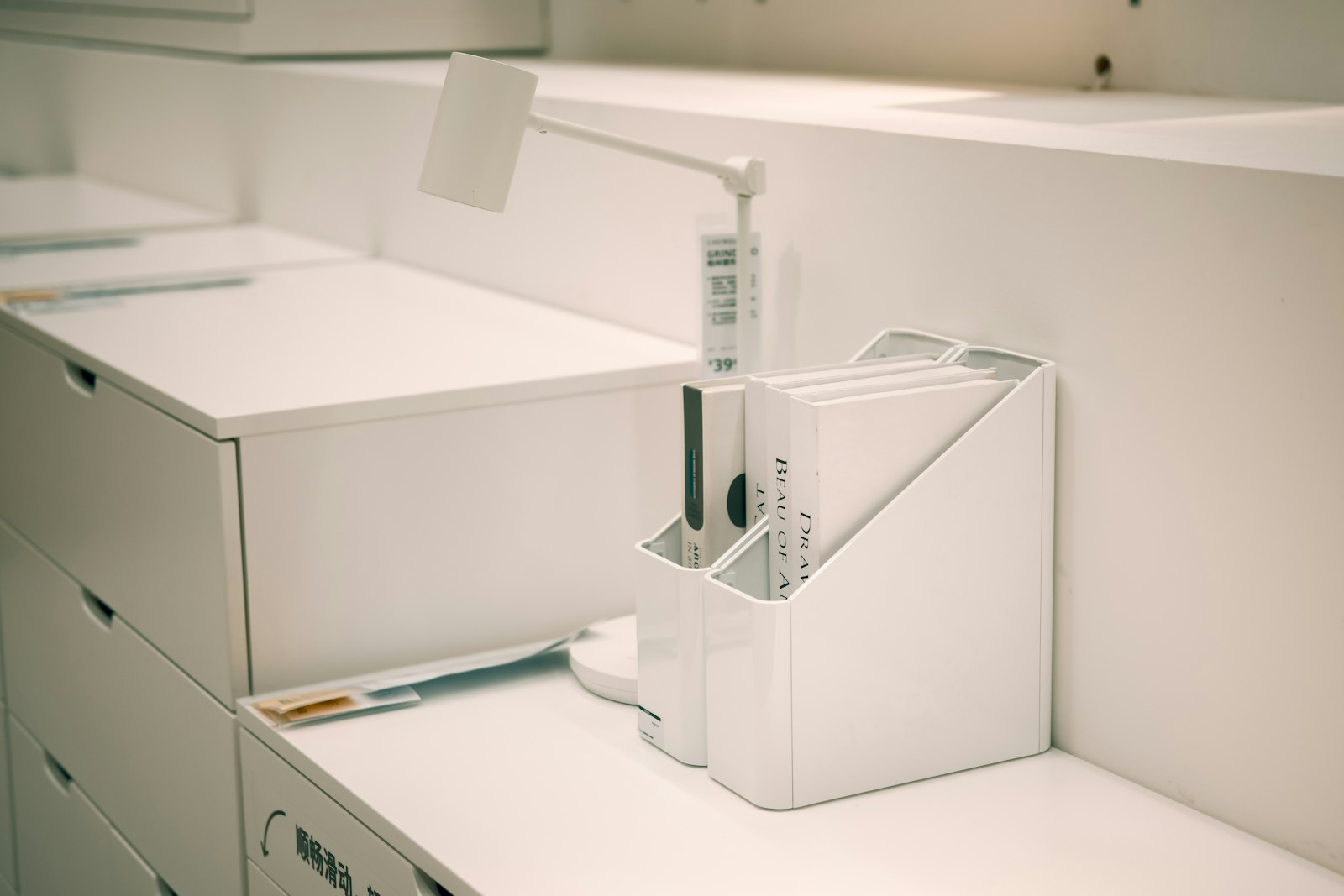 Organized white file organizer with documents on an office desk