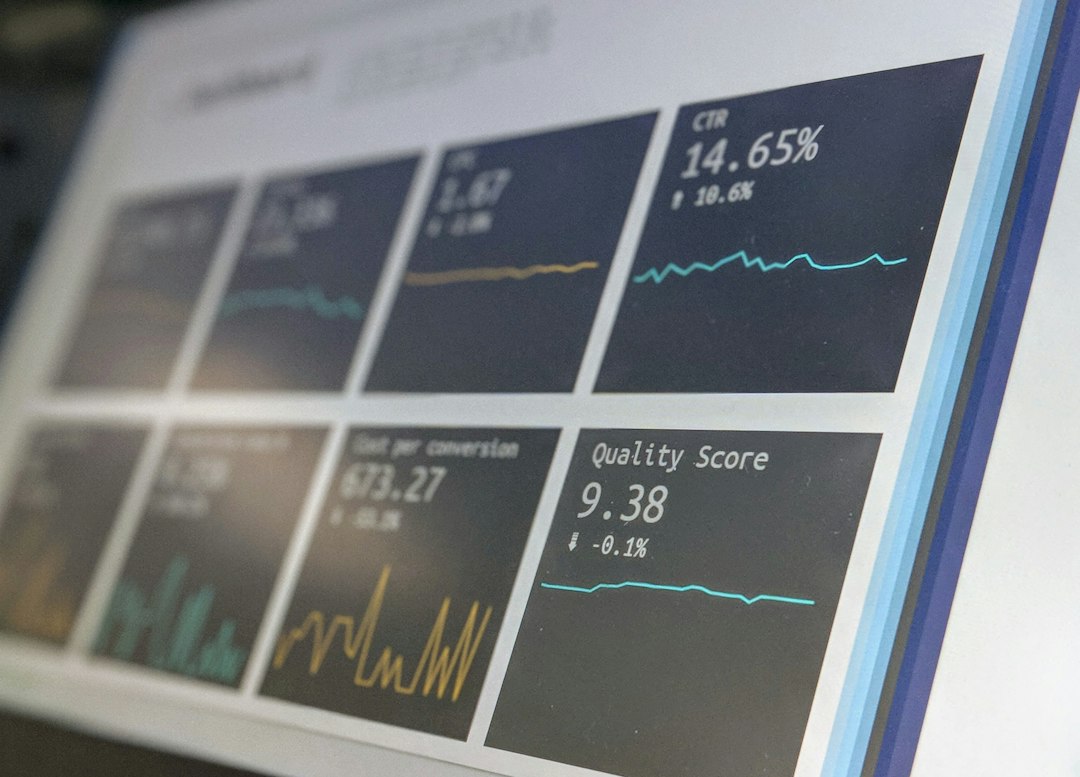 Laptop displaying a data reporting dashboard used in sell-side diligence
