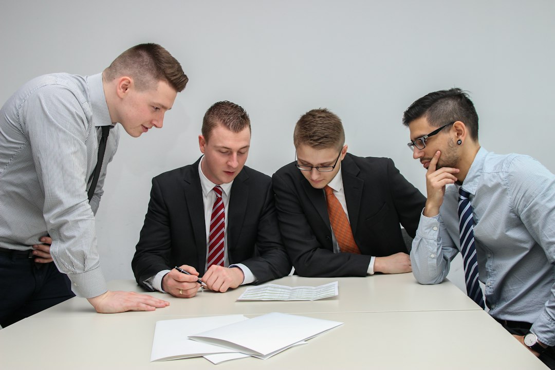 Business partners reviewing ownership papers together