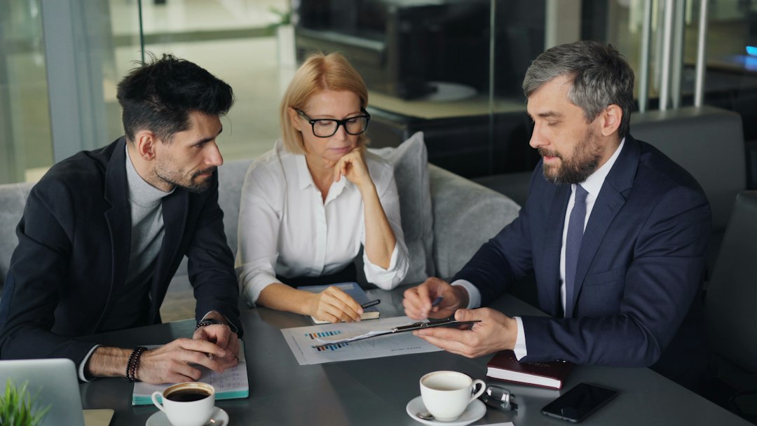 Family business owners meeting around a conference table