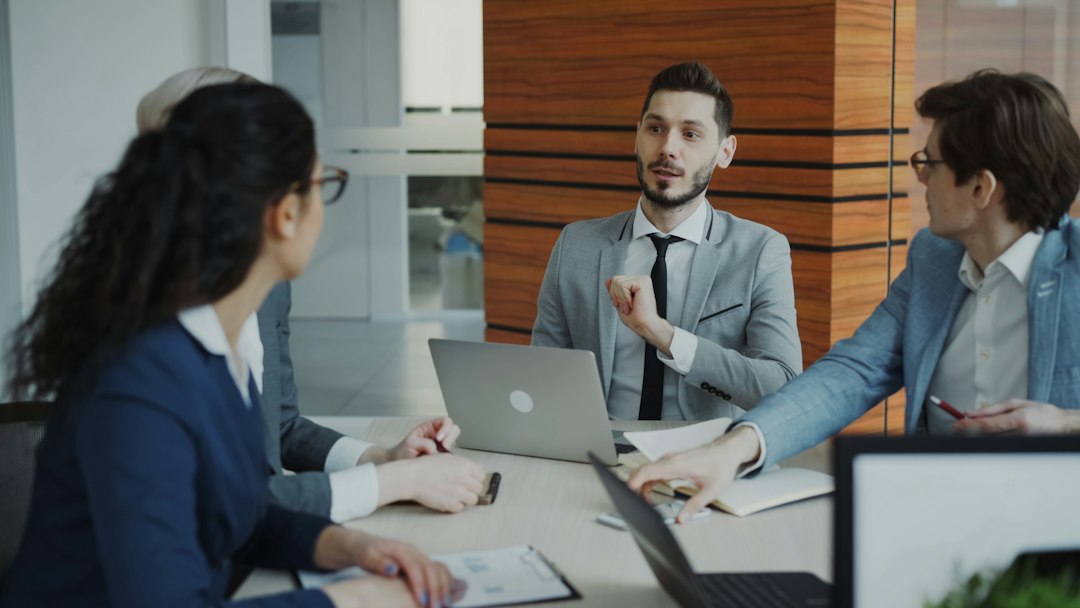 Executives reviewing financial charts before an exit transaction