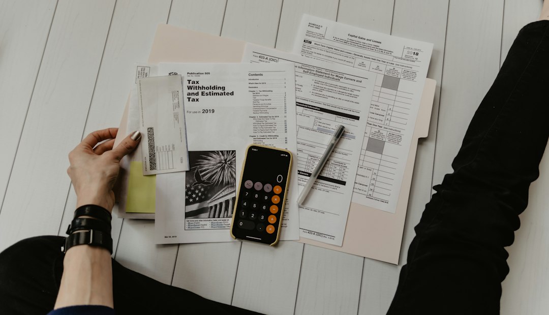Financial documents and calculator on a desk during a business review
