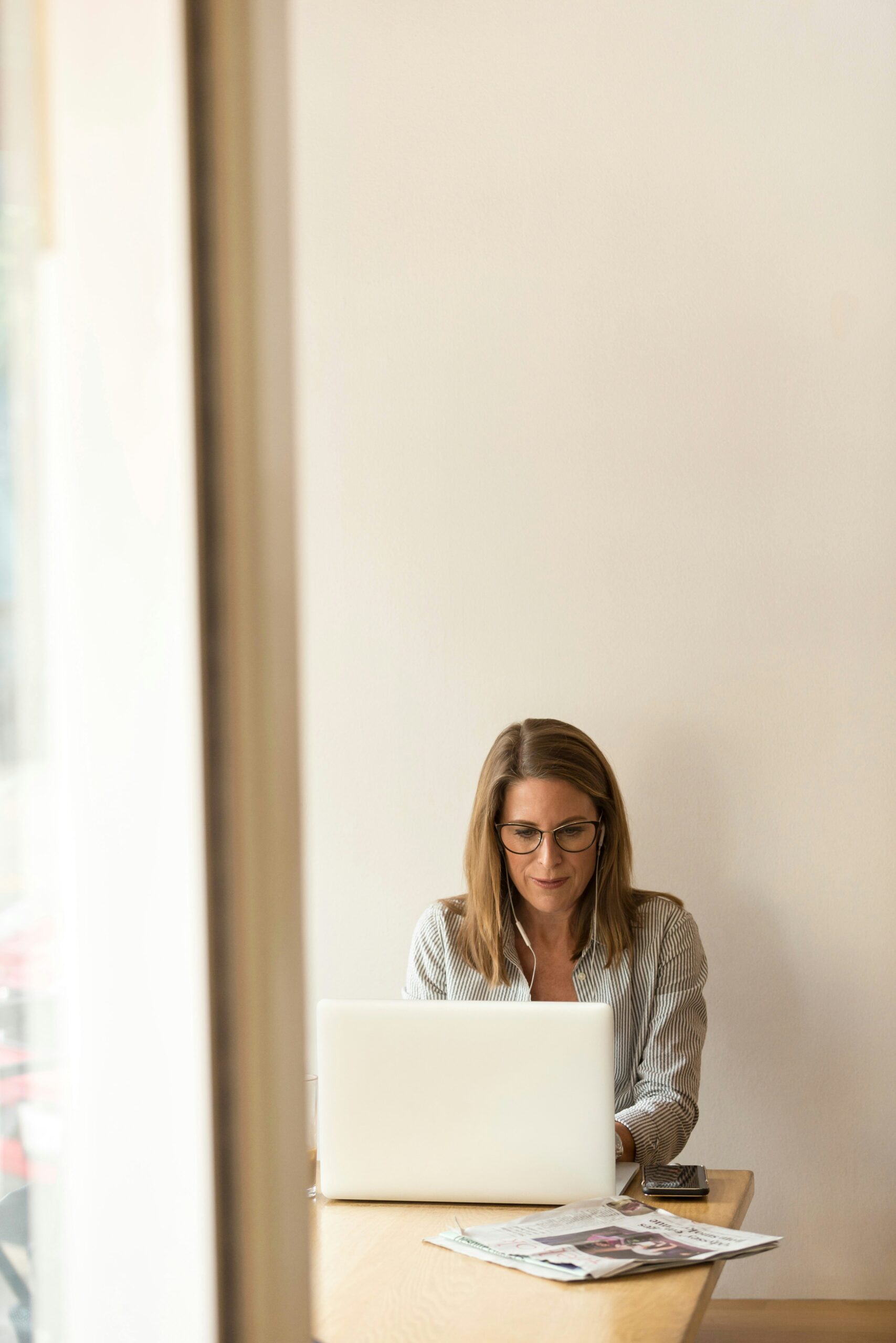 Business owner reviewing work on a laptop at a desk
